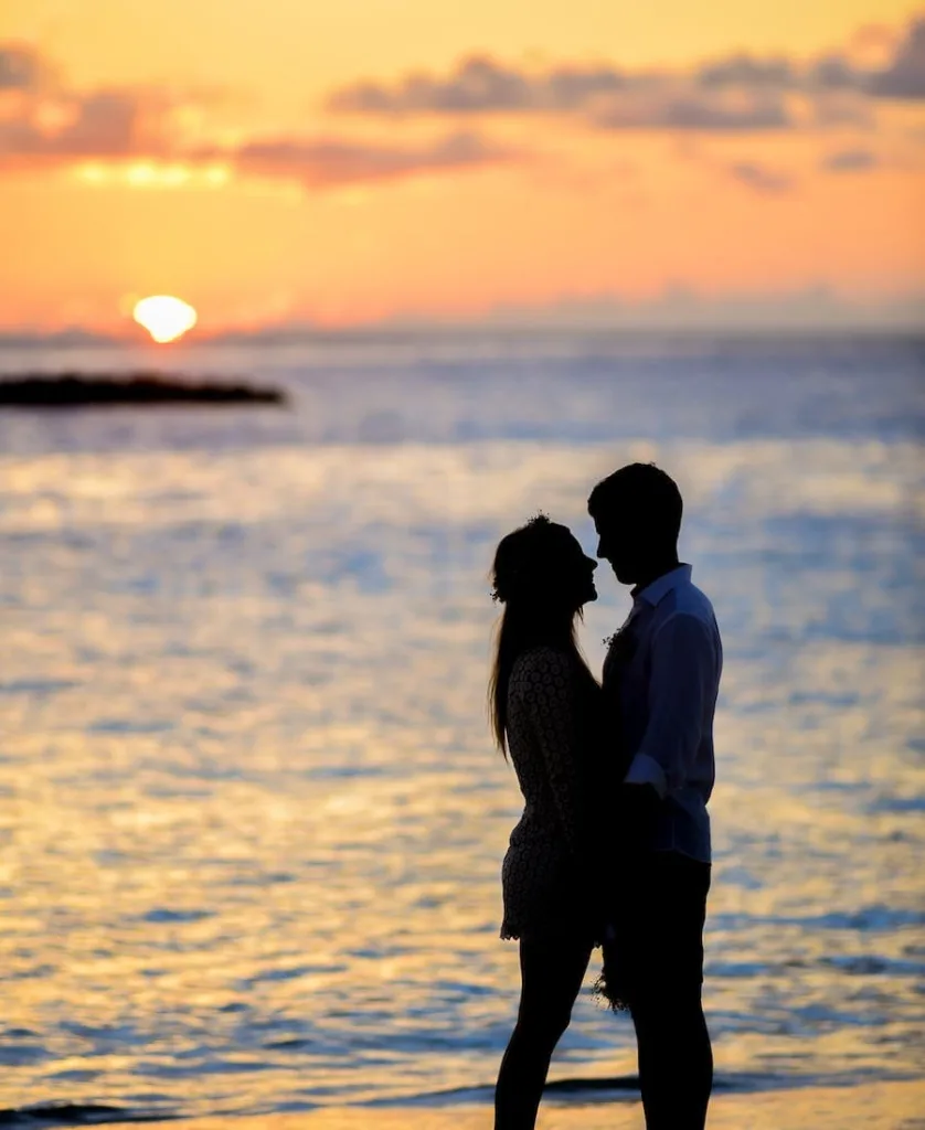 Couple on the beach in a sunset